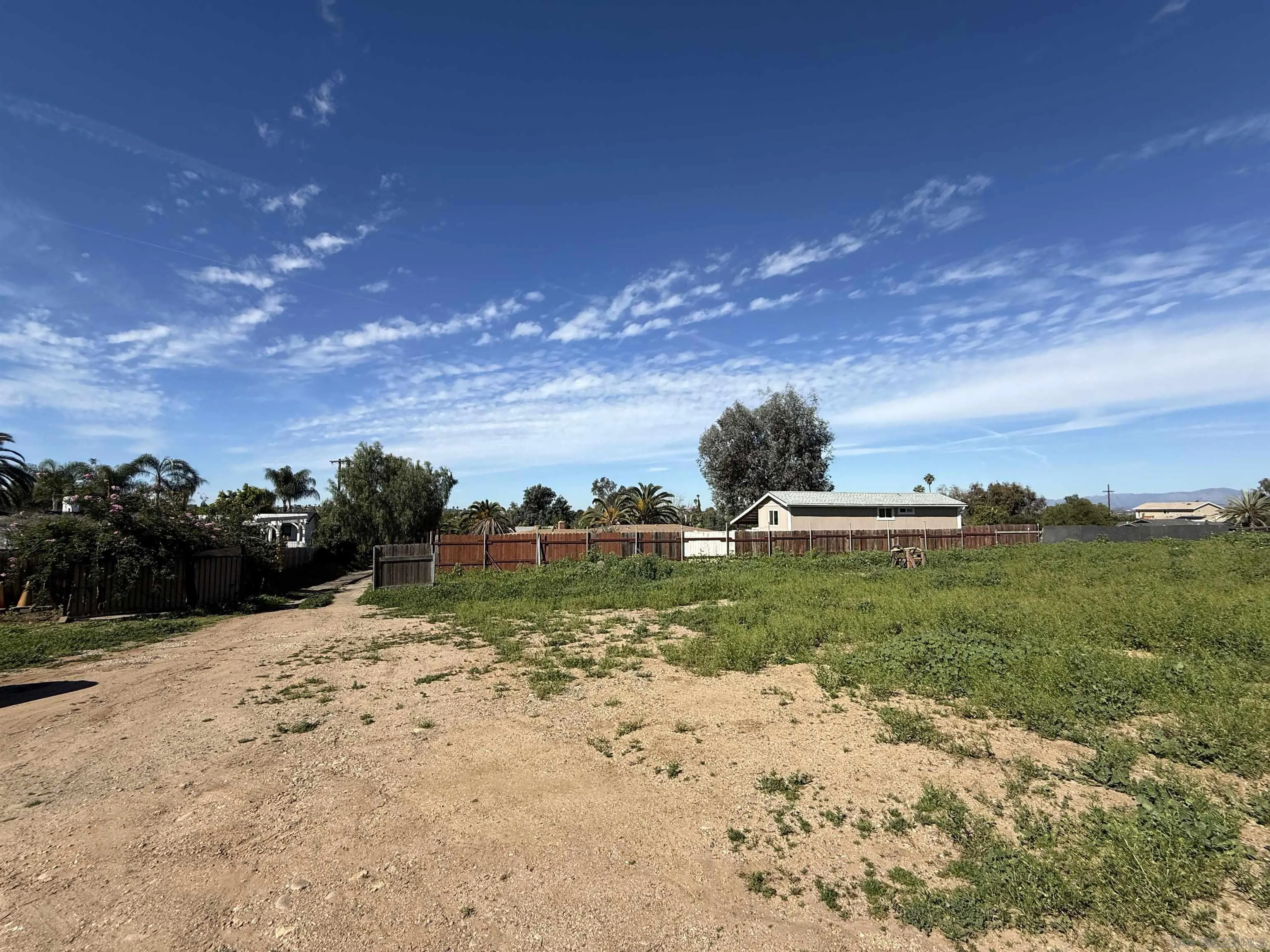 2055 Riviera Drive, Unit 195 Vista, CA 92084 - Photo 6 of 10 a view of a dry yard with a house