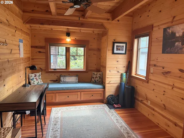a bedroom with a bed and a table