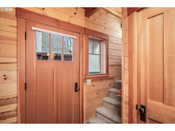 a view of a bathroom with a shower and a window