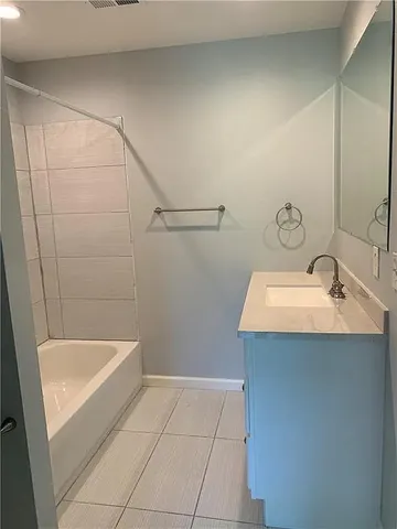 a bathroom with a sink and shower