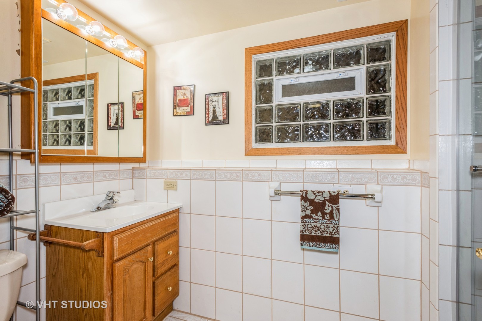 17W347 Forestview Road Bensenville, IL 60106 - Photo 18 of 25 a bathroom with a sink and a shower