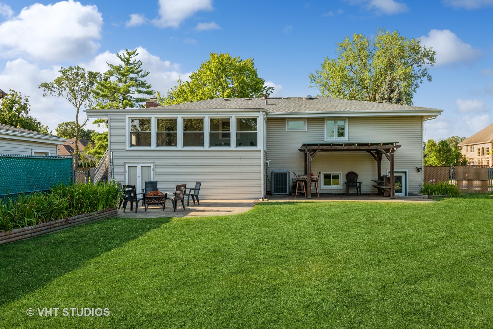 17W347 Forestview Road Bensenville, IL 60106 - Photo 21 of 25 a front view of a house with a garden and plants