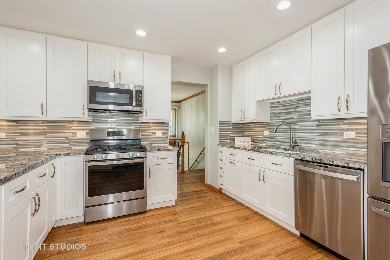 17W347 Forestview Road Bensenville, IL 60106 - Photo 3 of 25 a kitchen with stainless steel appliances granite countertop a stove a sink and a refrigerator