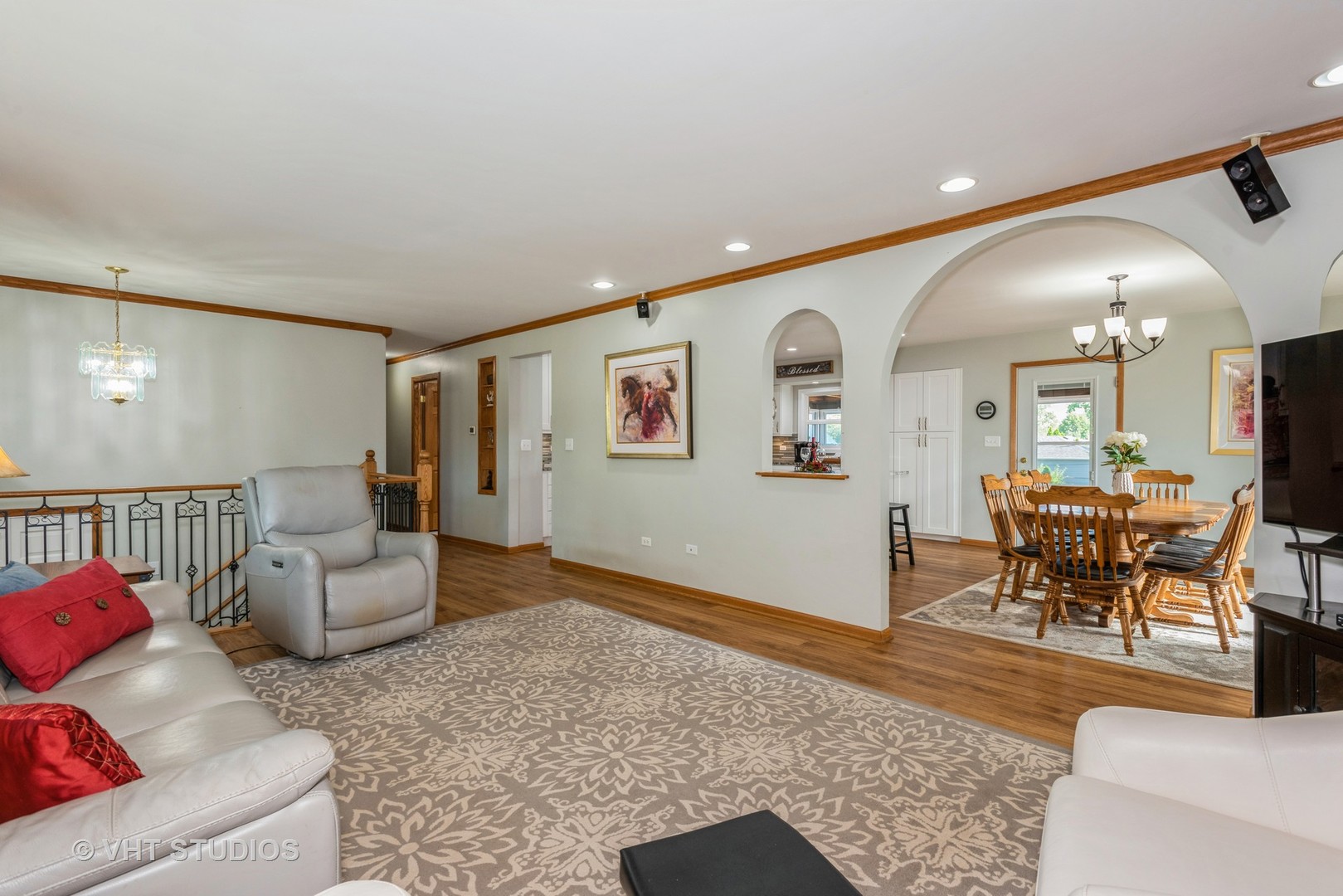17W347 Forestview Road Bensenville, IL 60106 - Photo 4 of 25 a living room with furniture and a dining table with wooden floor