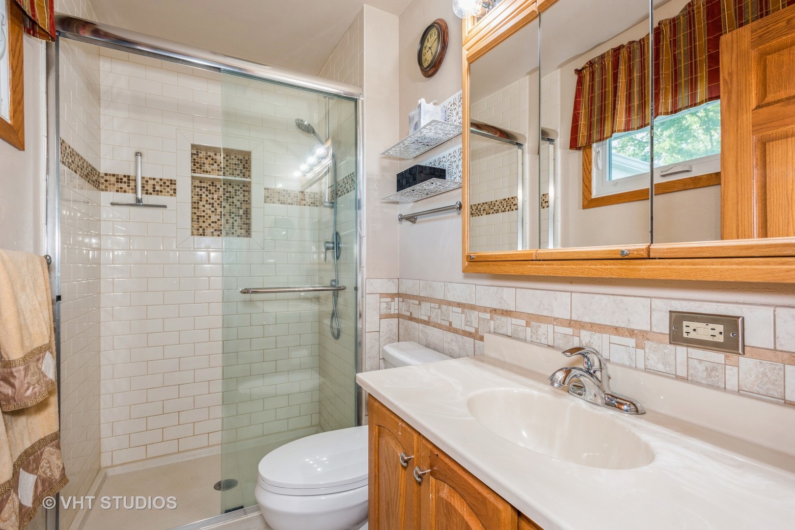 17W347 Forestview Road Bensenville, IL 60106 - Photo 10 of 25 a bathroom with a sink toilet and shower