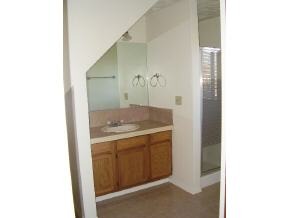 2740 North Reed Road Chino Valley, AZ 86323 - Photo 5 of 8 a bathroom with a granite countertop sink and a mirror