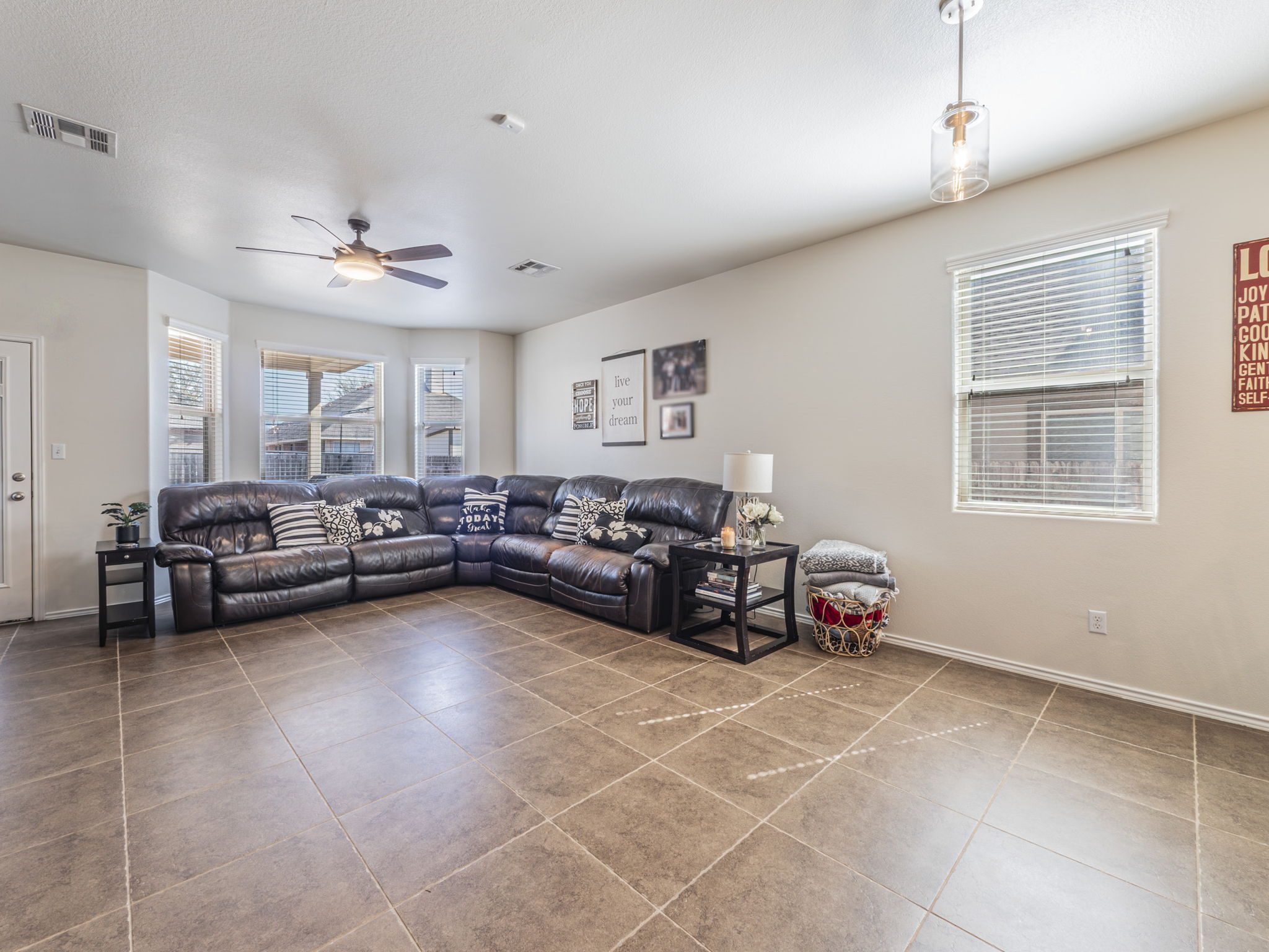 1366 Heep Run Buda, TX 78610 - Photo 7 of 37 Living area featuring ceiling fan and light tile patterned floors