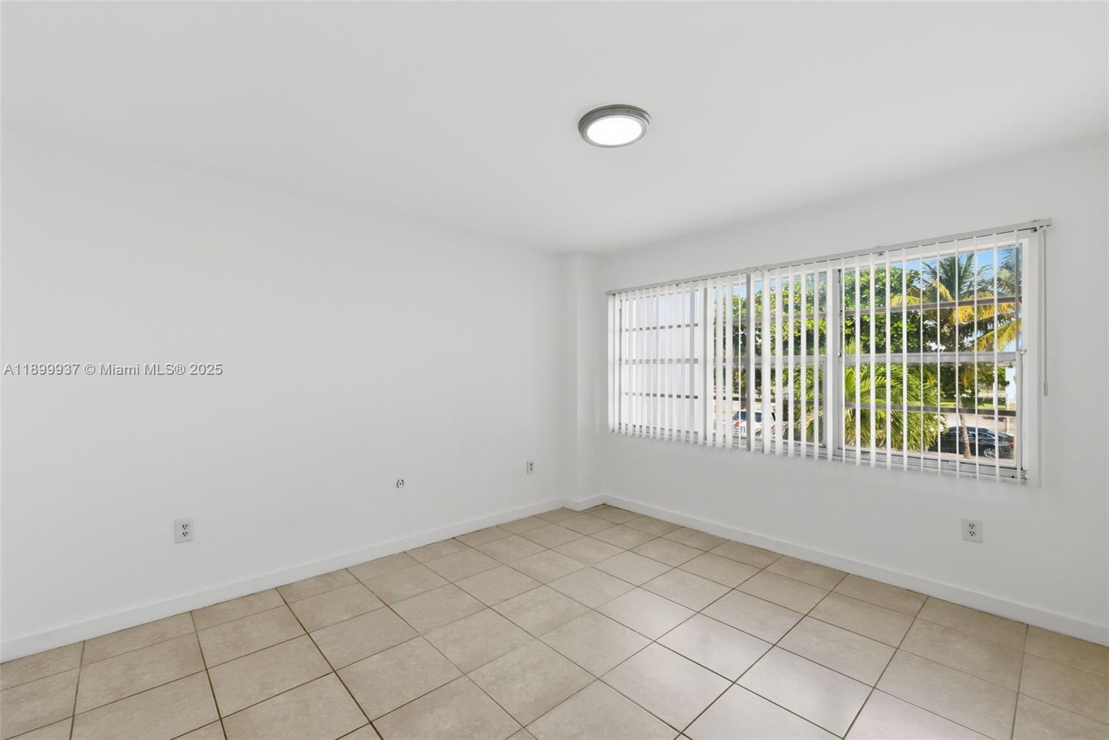 624 Northwest 11th Street, Unit 624 Miami, FL 33136 - Photo 12 of 30 a view of an empty room with a window