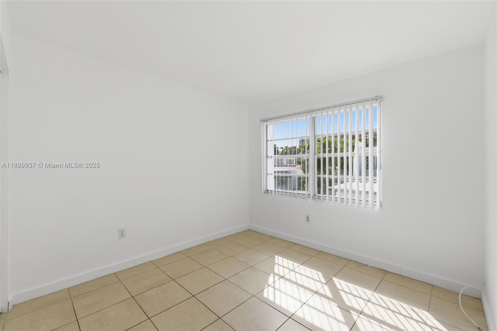 624 Northwest 11th Street, Unit 624 Miami, FL 33136 - Photo 17 of 30 a view of an empty room with a window