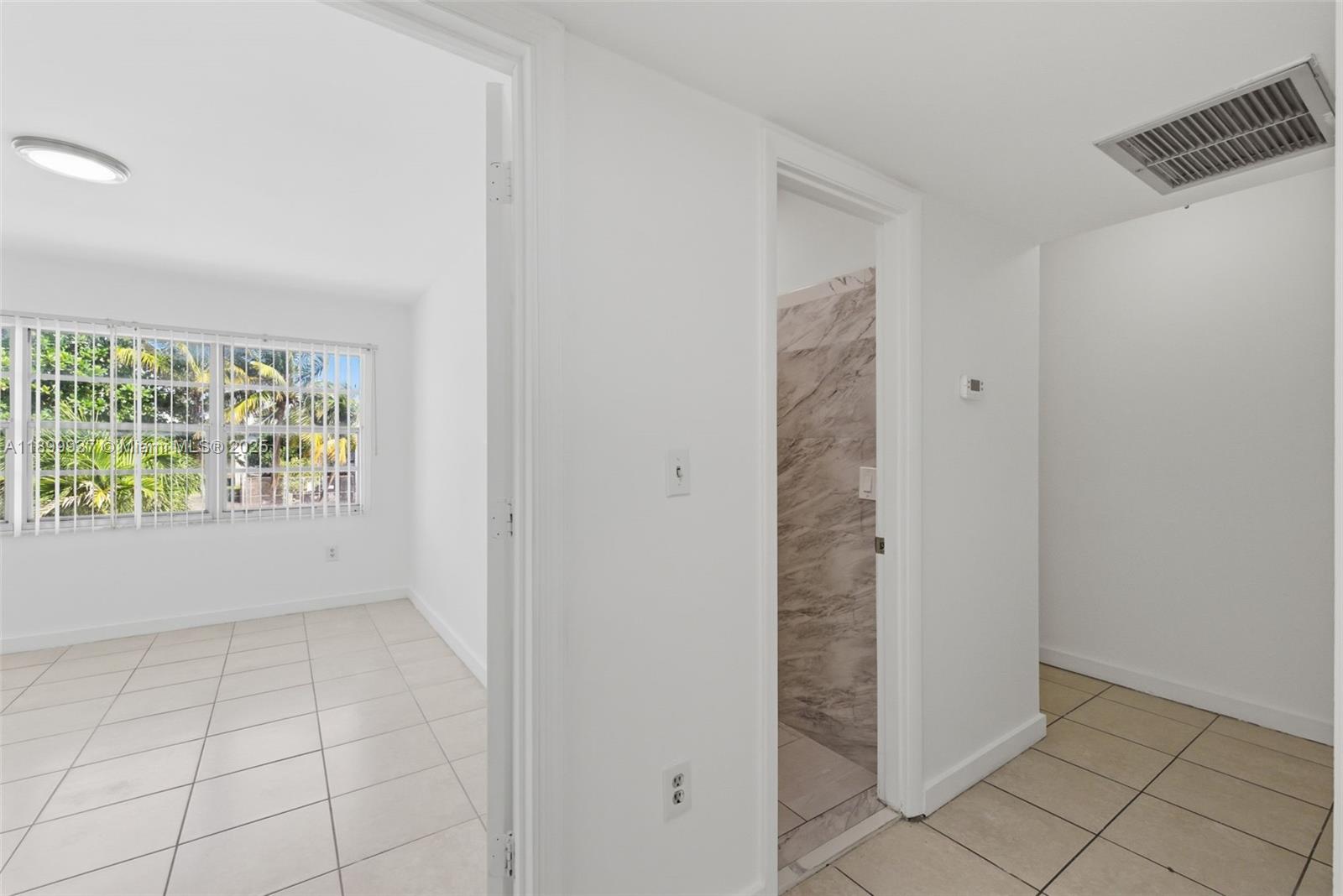 624 Northwest 11th Street, Unit 624 Miami, FL 33136 - Photo 19 of 30 an empty room with windows