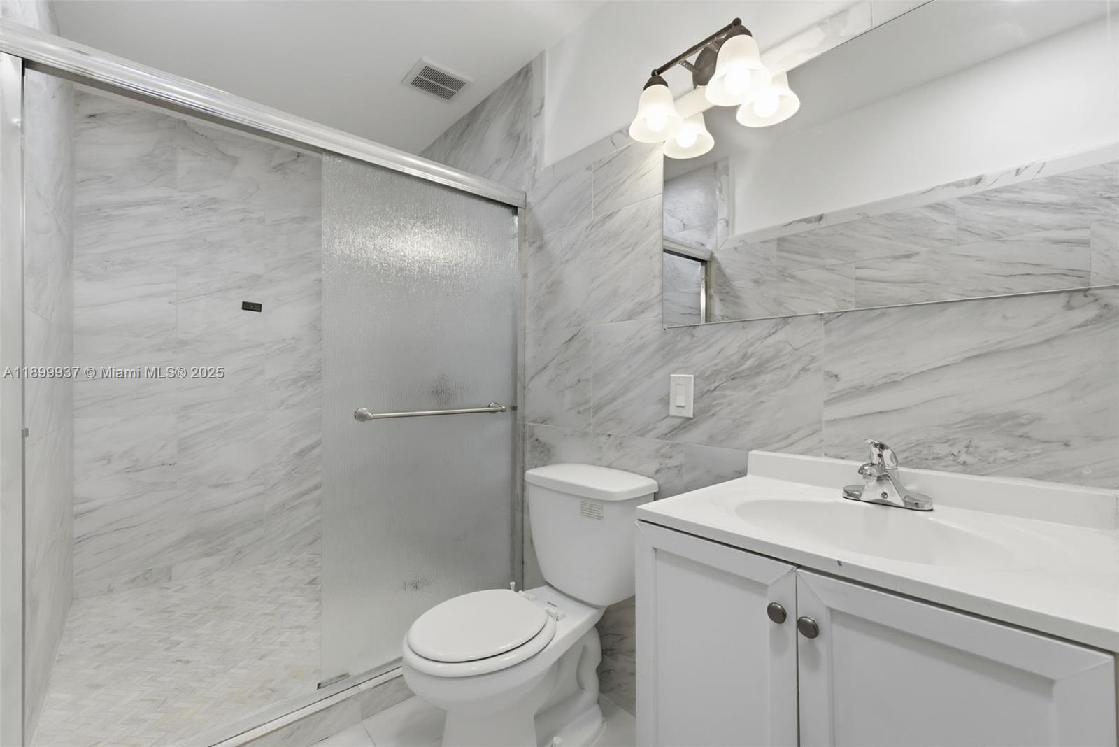 624 Northwest 11th Street, Unit 624 Miami, FL 33136 - Photo 22 of 30 a bathroom with a sink toilet and shower