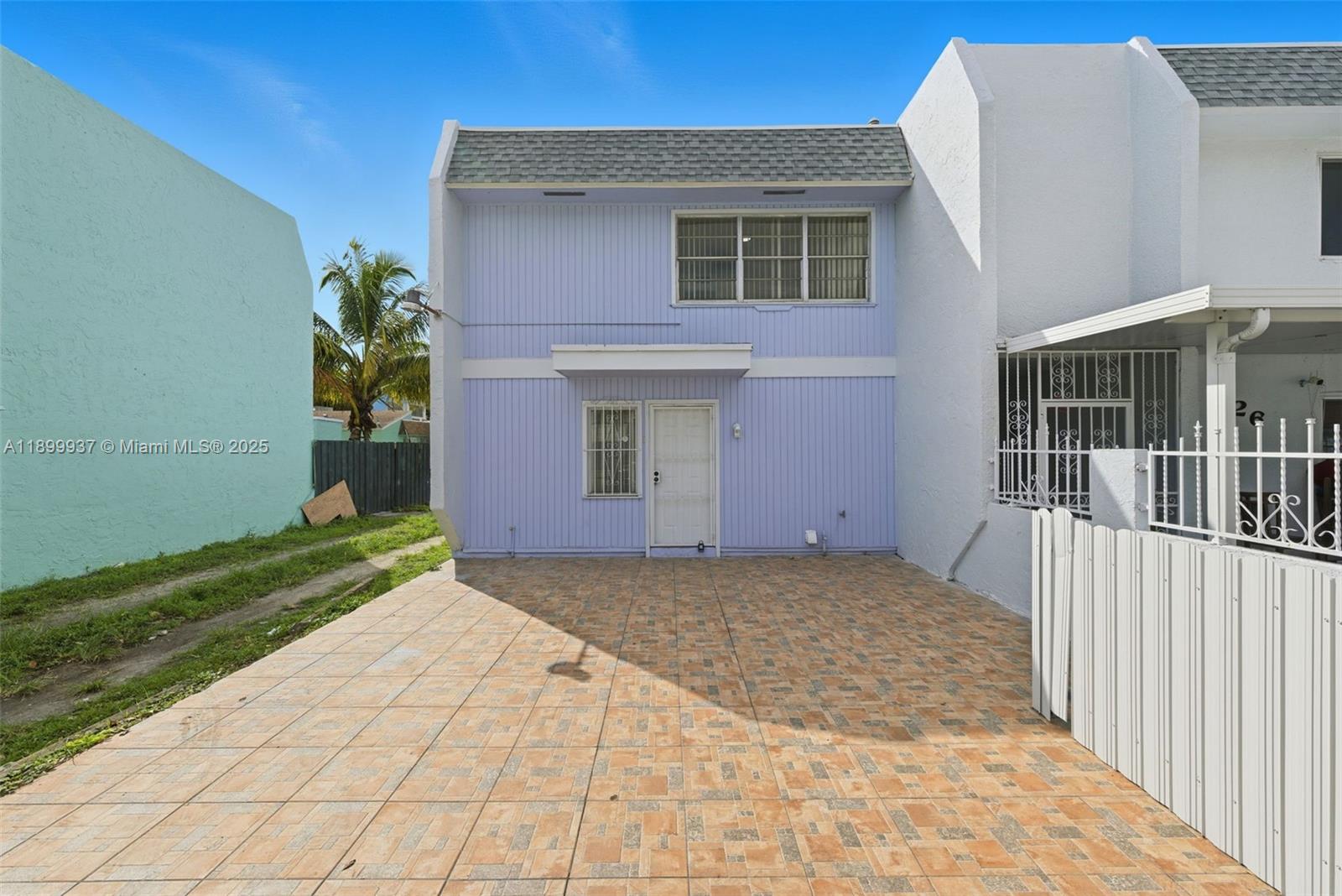624 Northwest 11th Street, Unit 624 Miami, FL 33136 - Photo 25 of 30 a view of a house with a yard