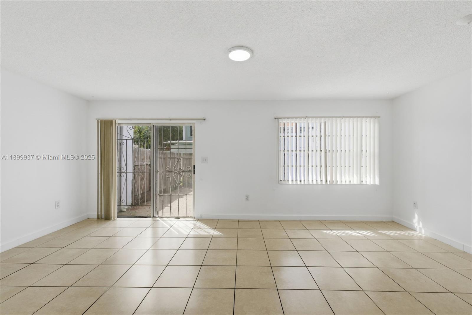 624 Northwest 11th Street, Unit 624 Miami, FL 33136 - Photo 9 of 30 a view of an empty room and window