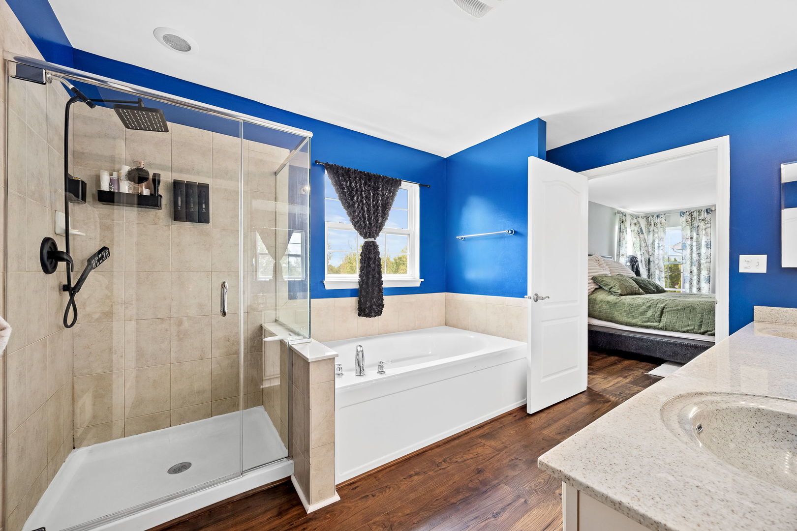 2297 Deerpath Road Bolingbrook, IL 60490 - Photo 23 of 46 a bathroom with a tub a mirror and a shower