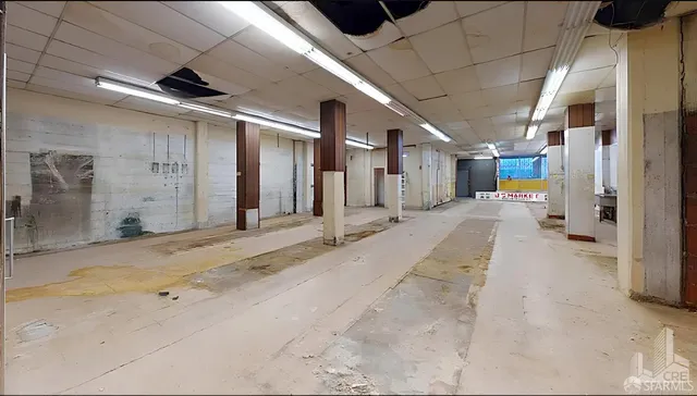 a view of a hallway with seating area