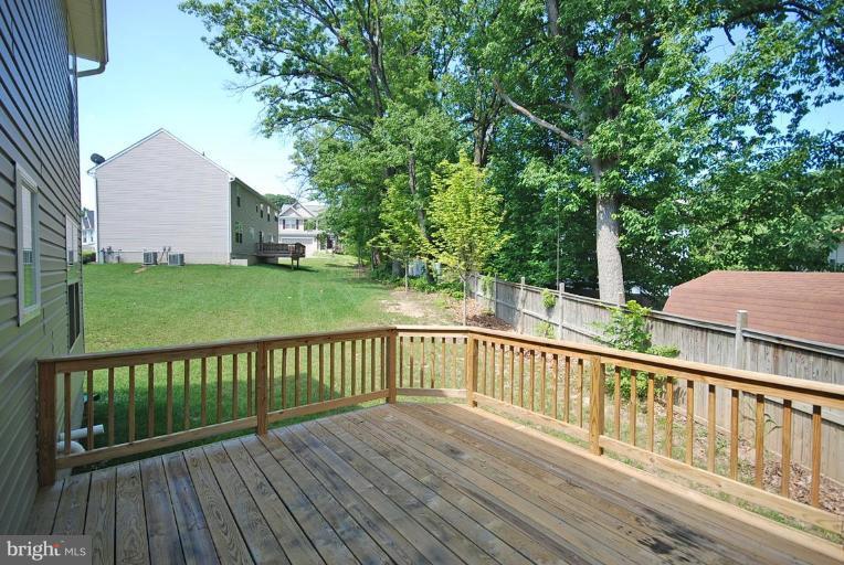 5954 Florey Road Hanover, MD 21076 - Photo 30 of 30 a view of a wooden deck and a yard