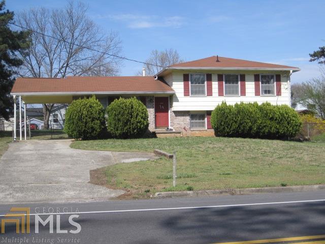 2552 Rex Road Ellenwood, GA 30294 - Photo 1 of 1 a front view of a house with garden
