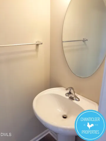 a bathroom with a sink and mirror