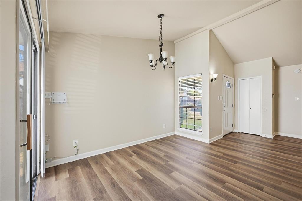 4526 Carr Street The Colony, TX 75056 - Photo 11 of 19 a view of an empty room with wooden floor and a window
