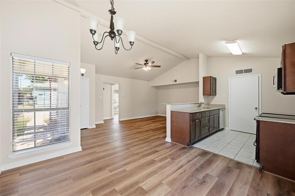 4526 Carr Street The Colony, TX 75056 - Photo 19 of 19 a view of a kitchen with a sink a refrigerator and window