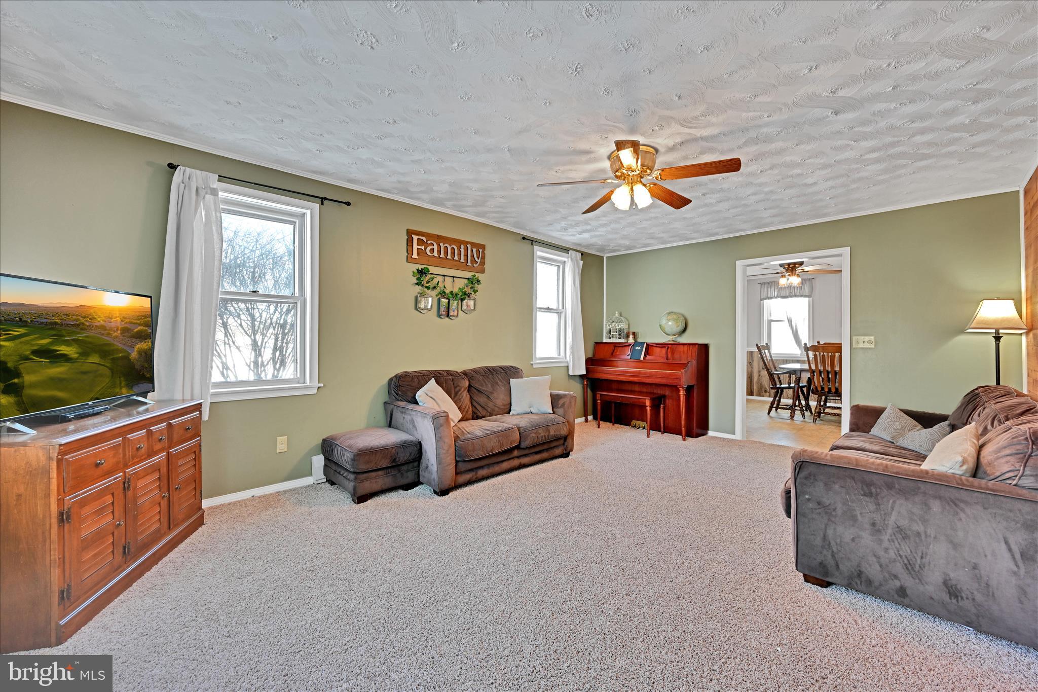 204 Reistville Road Myerstown, PA 17067 - Photo 16 of 55 a living room with furniture and a flat screen tv