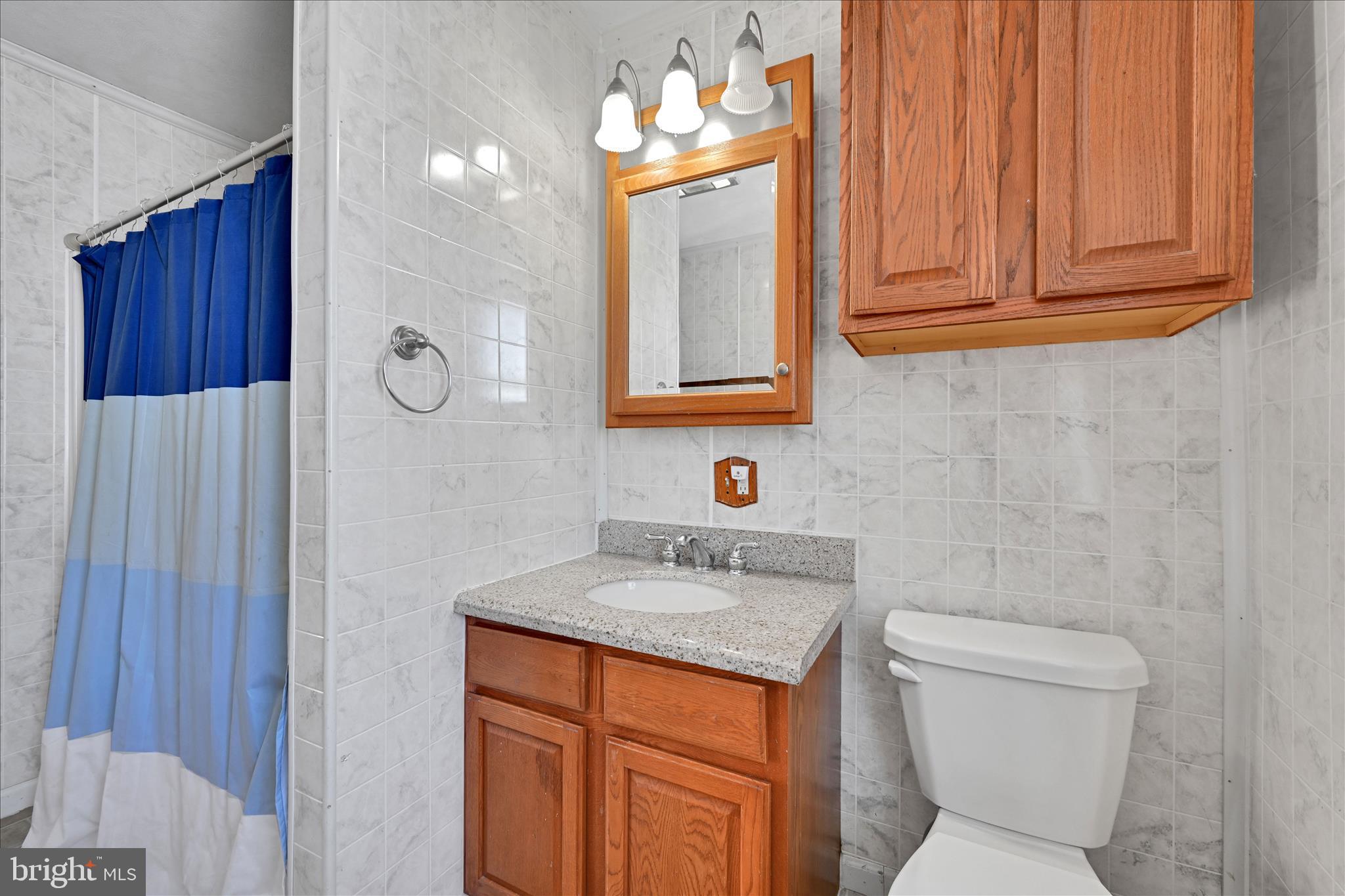 204 Reistville Road Myerstown, PA 17067 - Photo 32 of 55 a bathroom with a granite countertop sink toilet and mirror