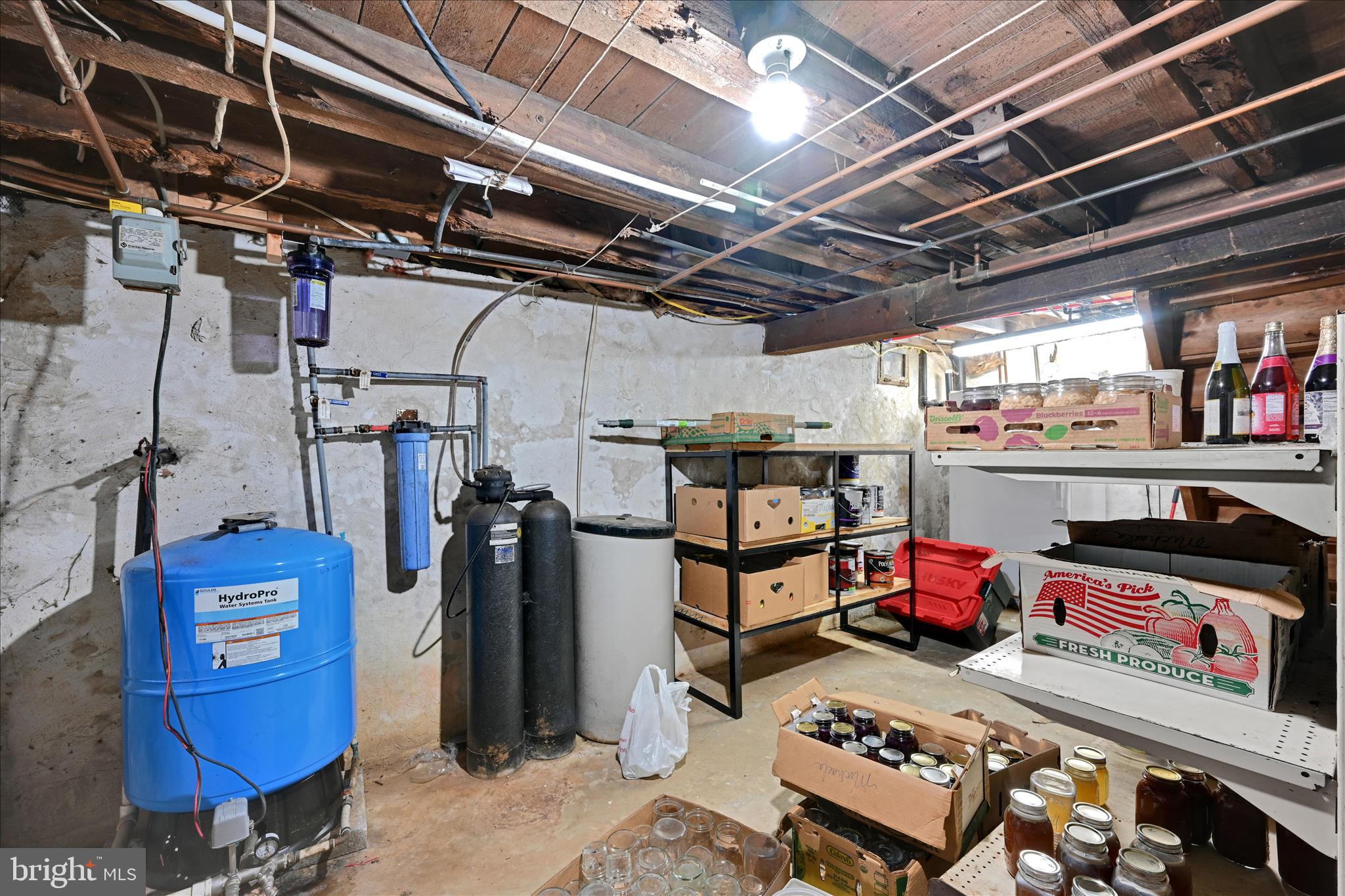 204 Reistville Road Myerstown, PA 17067 - Photo 39 of 55 a storage room with water heater and racks