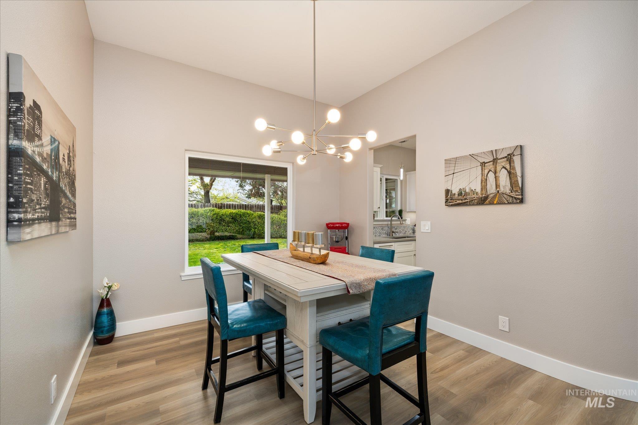2250 North Amethyst Avenue Meridian, ID 83646 - Photo 12 of 50 Dining room featuring light wood-style floors and hanging lights