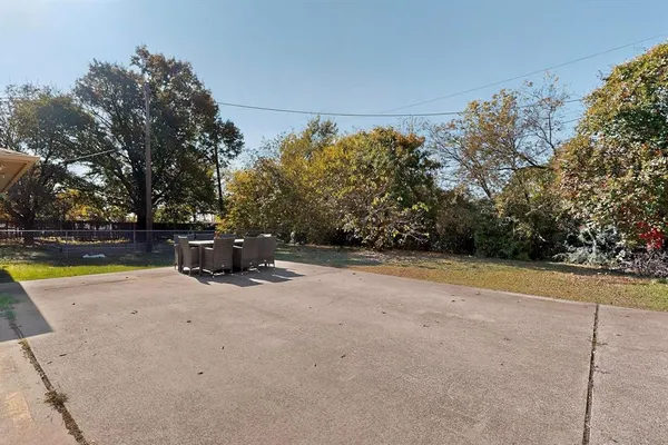 a view of a swimming pool with an outdoor space and seating area