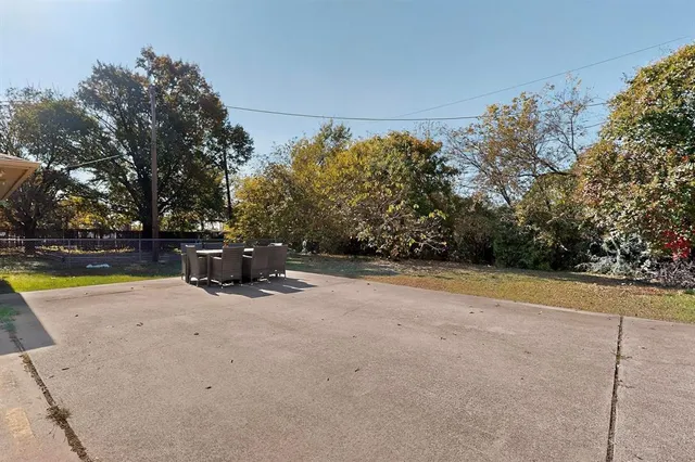 a view of a swimming pool with an outdoor space and seating area