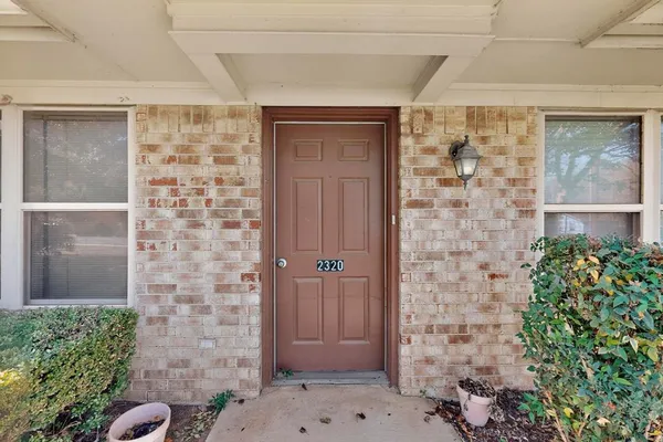 a front view of a house with a glass door