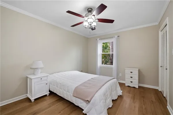 a bedroom with a large bed and a window