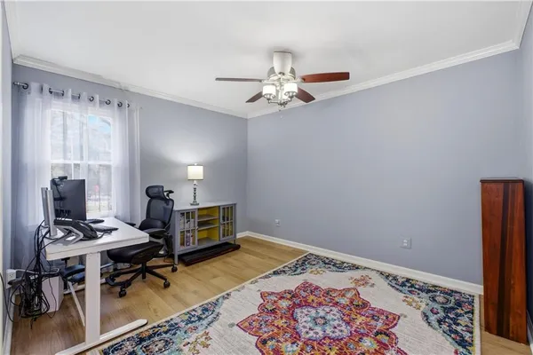 a bedroom with furniture and a window