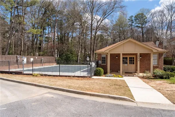 a house with trees in the background