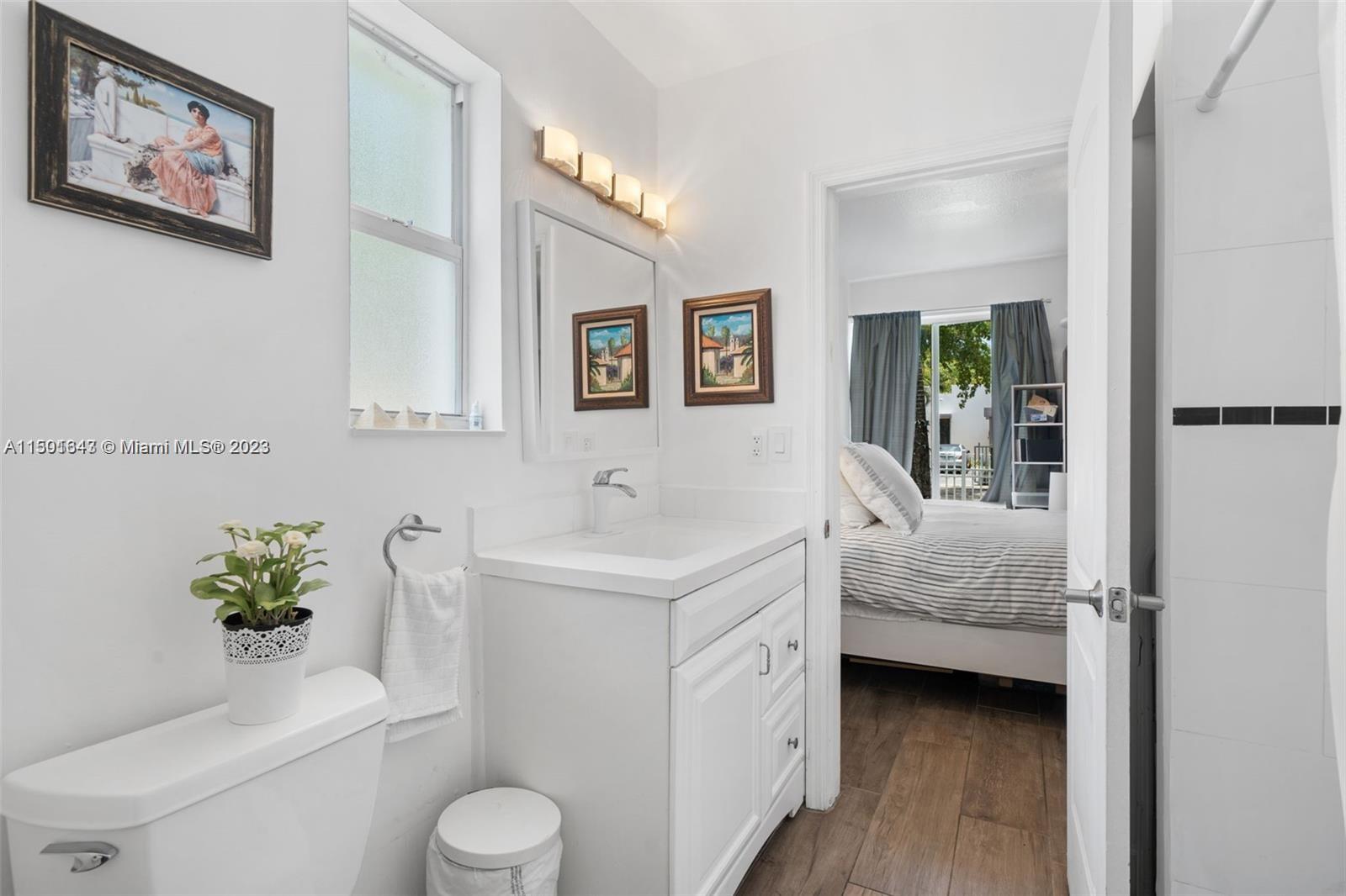 555 Northeast 70th Street Miami, FL 33138 - Photo 11 of 19 a bathroom with a sink toilet and tub