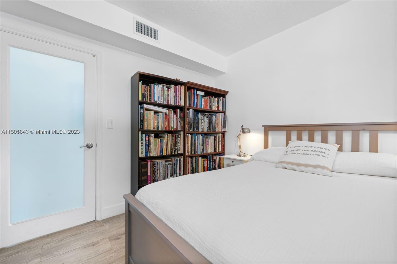 555 Northeast 70th Street Miami, FL 33138 - Photo 15 of 19 a large white bed in a white room