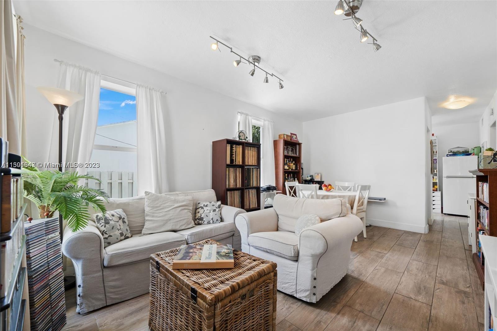 555 Northeast 70th Street Miami, FL 33138 - Photo 2 of 19 a living room with furniture and wooden floor
