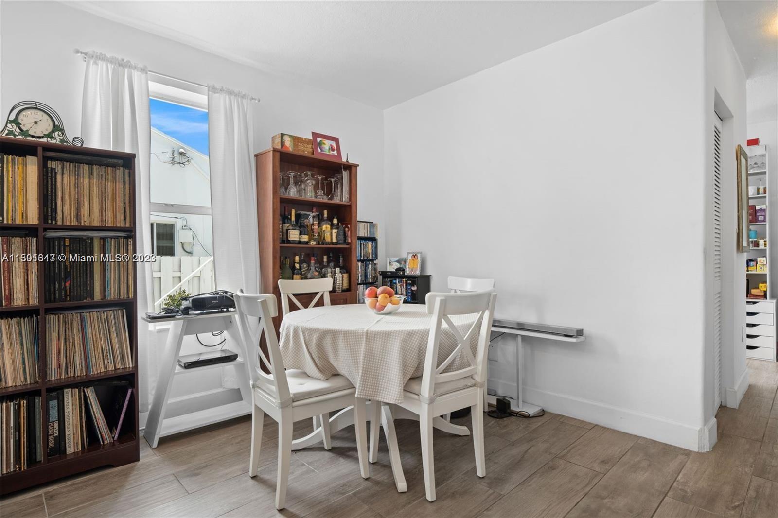 555 Northeast 70th Street Miami, FL 33138 - Photo 6 of 19 a dining room with furniture and wooden floor