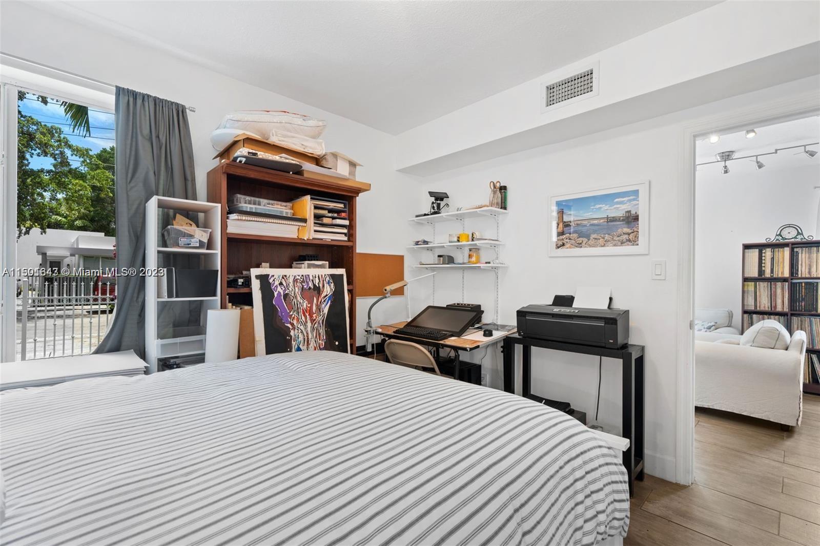555 Northeast 70th Street Miami, FL 33138 - Photo 9 of 19 a bed room with a bed and a chair
