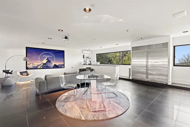 a view of a living room and dining room