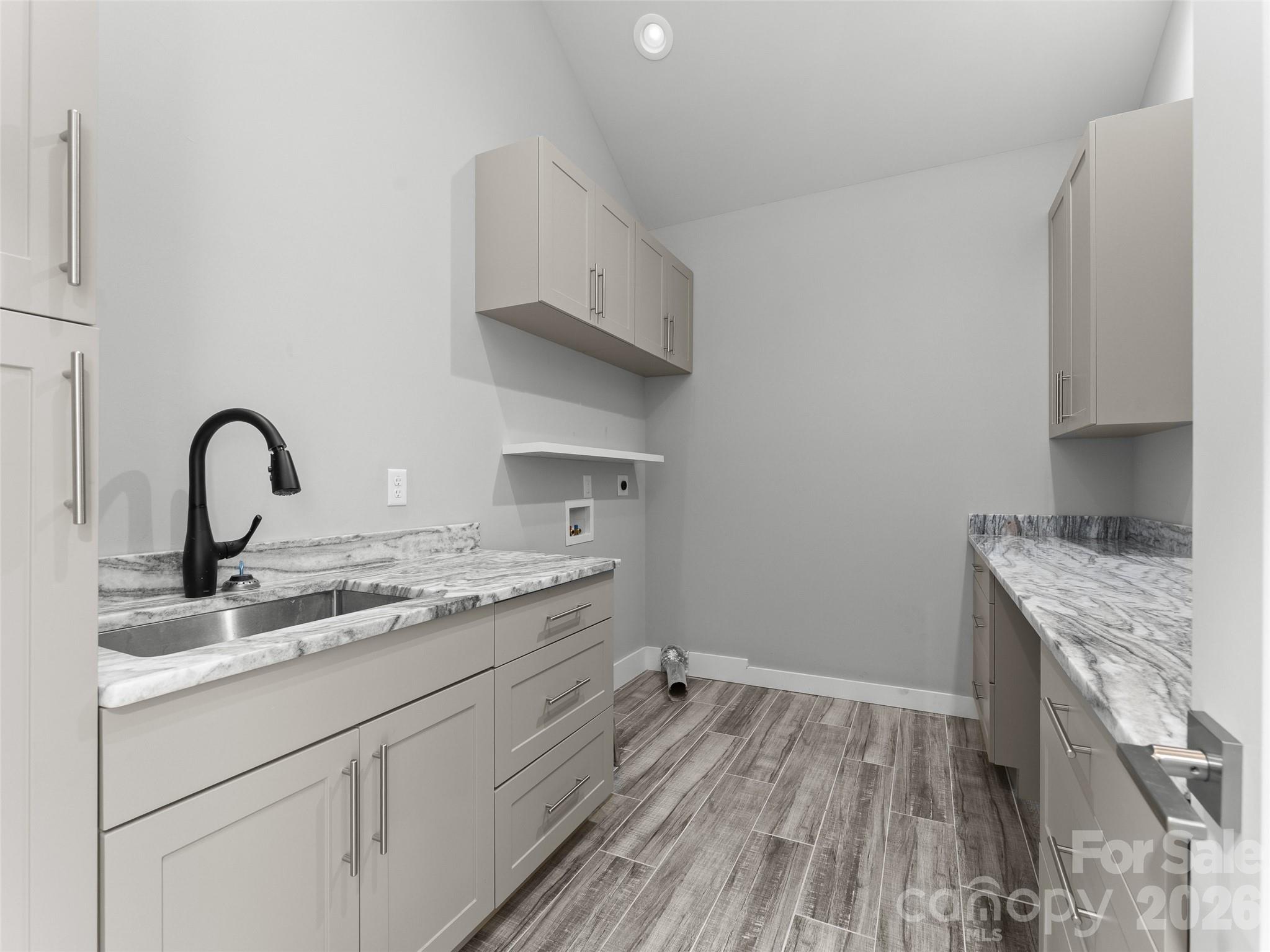 123 Israel Road Candler, NC 28715 - Photo 26 of 44 a kitchen with a sink and cabinets