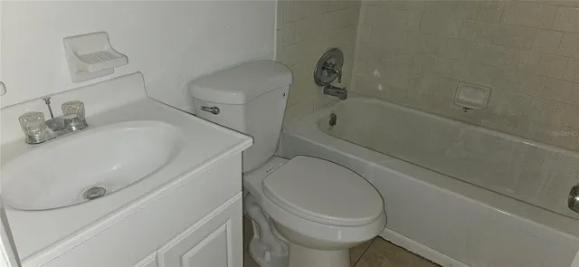 a bathroom with a sink and toilet