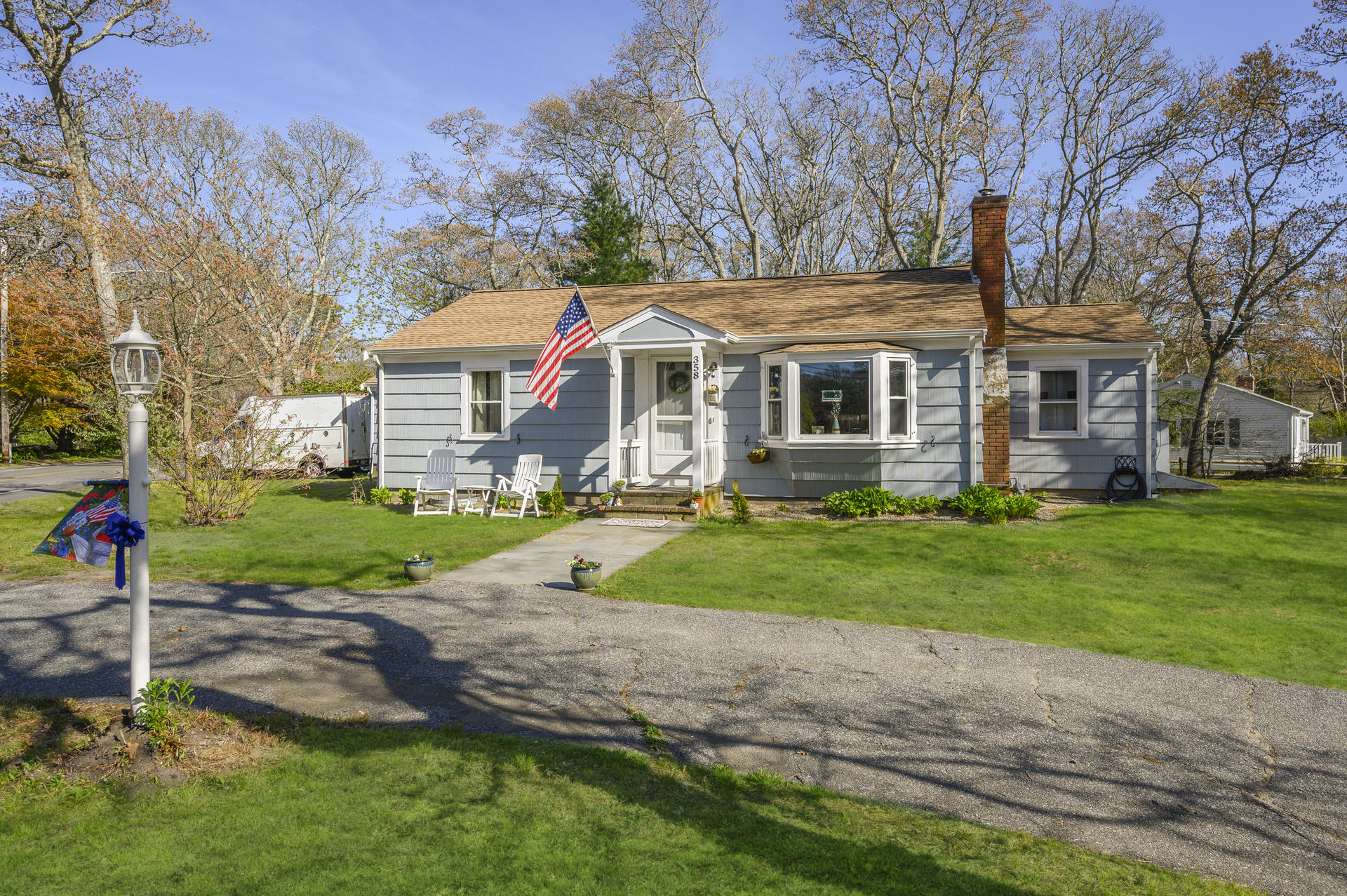 358 Strawberry Hill Road Centerville, MA 02632 - Photo 1 of 25 a front view of house with yard and green space