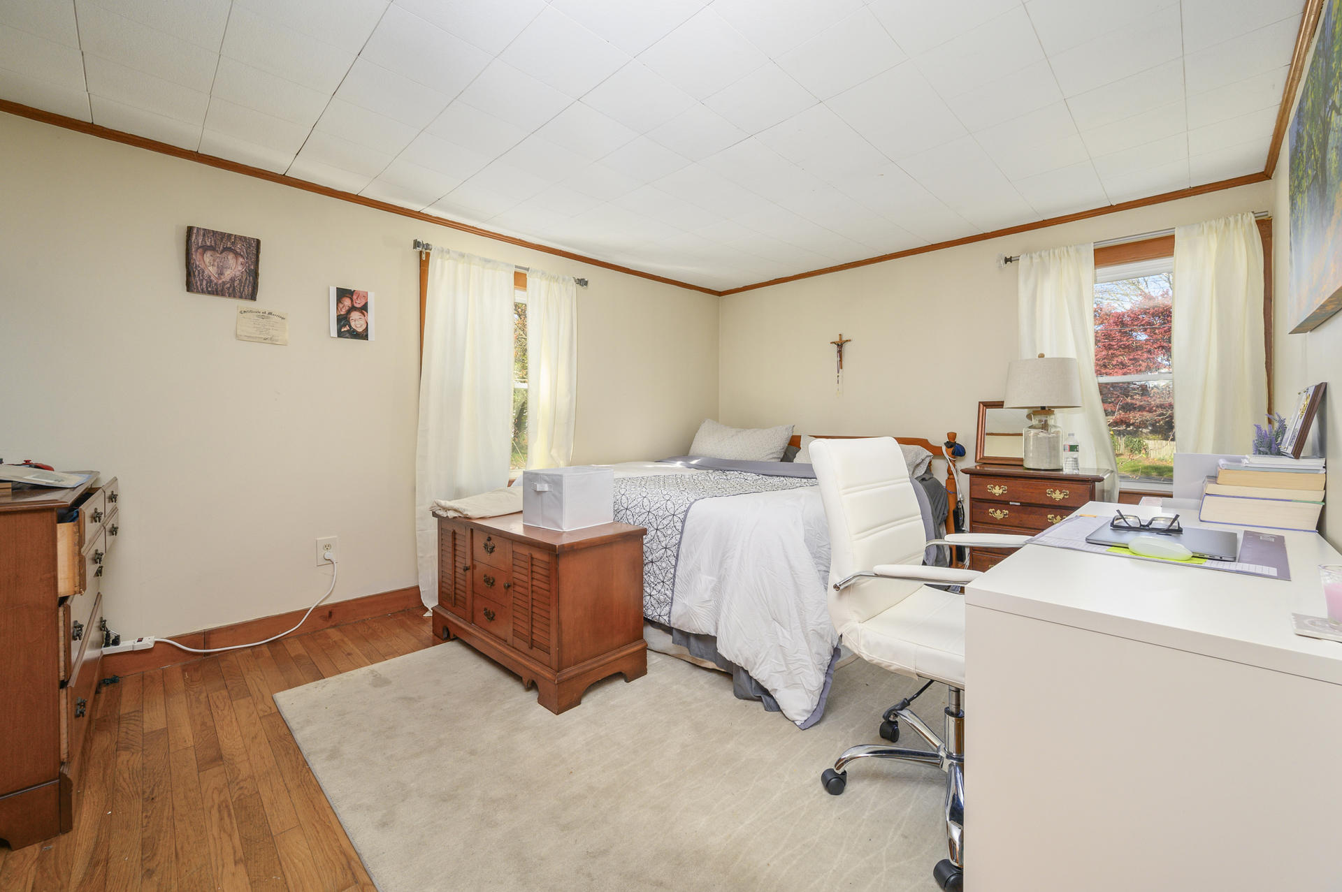358 Strawberry Hill Road Centerville, MA 02632 - Photo 12 of 25 a bed room with a bed furniture and a large window