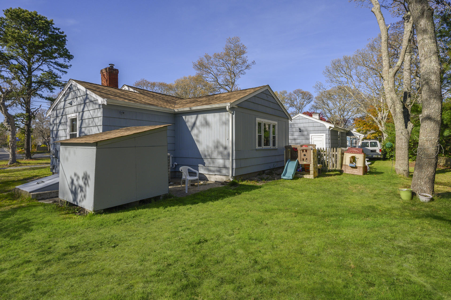 358 Strawberry Hill Road Centerville, MA 02632 - Photo 16 of 25 a view of a house with a yard