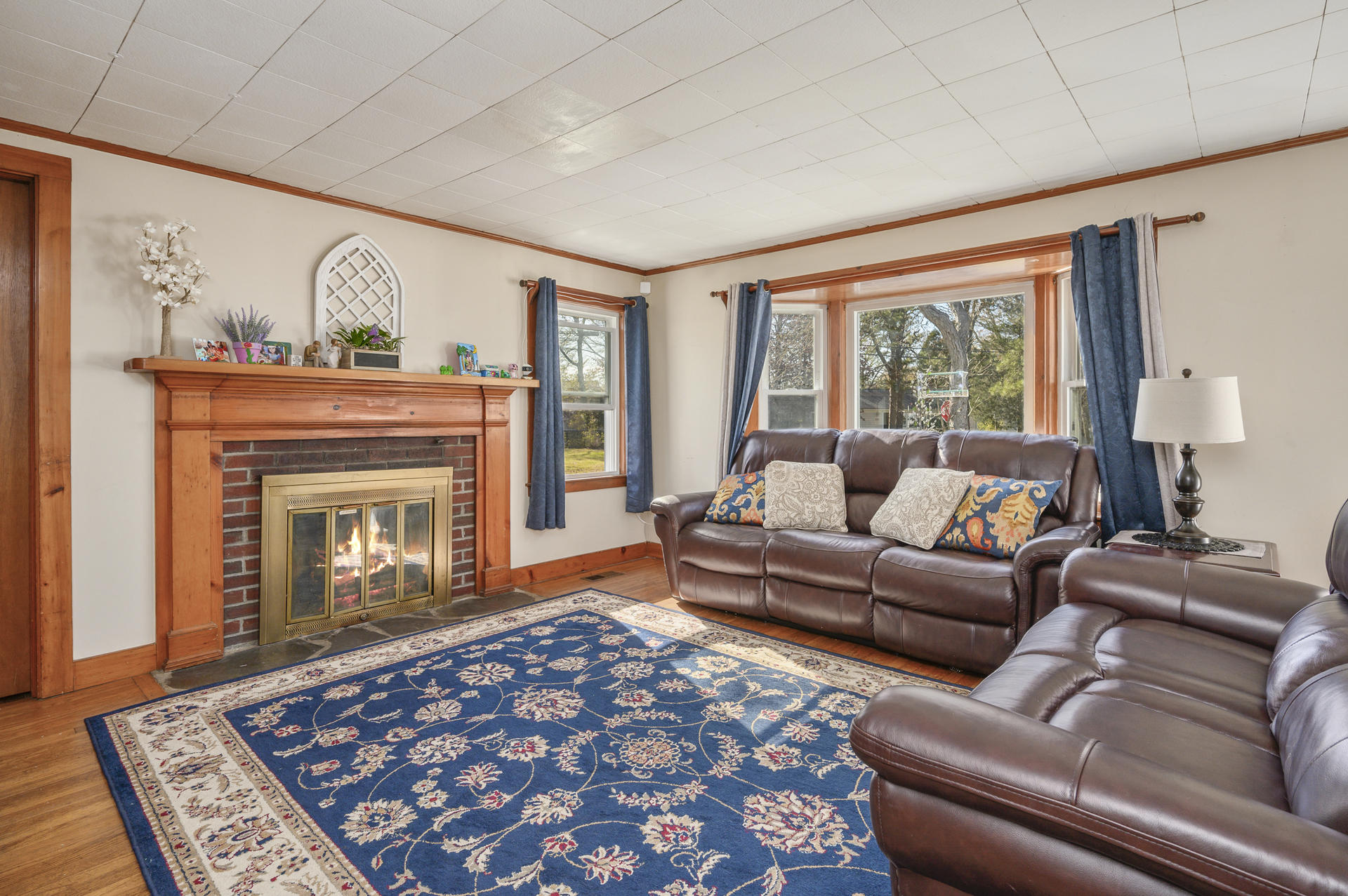 358 Strawberry Hill Road Centerville, MA 02632 - Photo 2 of 25 a living room with furniture and a fireplace