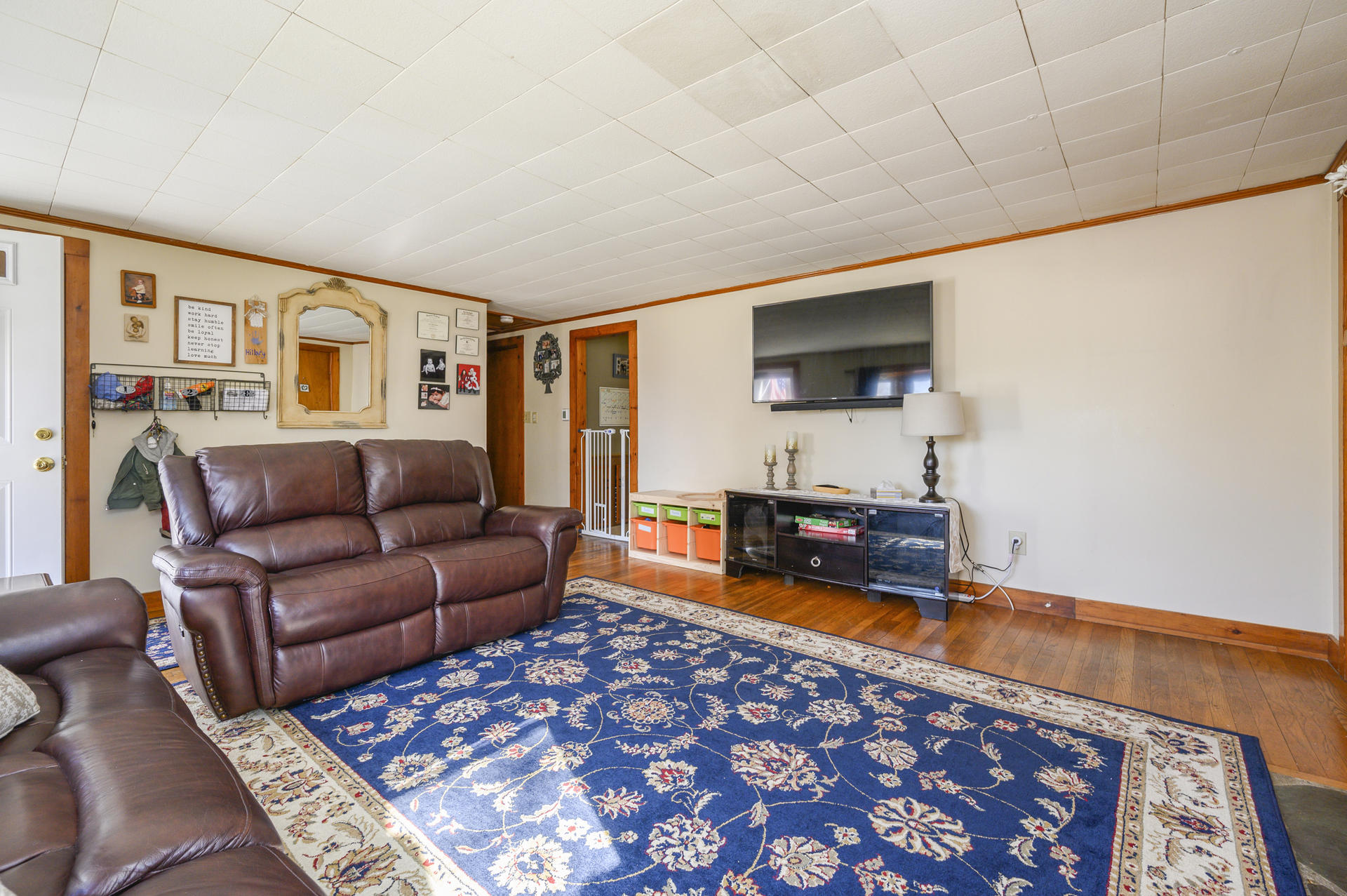 358 Strawberry Hill Road Centerville, MA 02632 - Photo 4 of 25 a living room with furniture and a flat screen tv