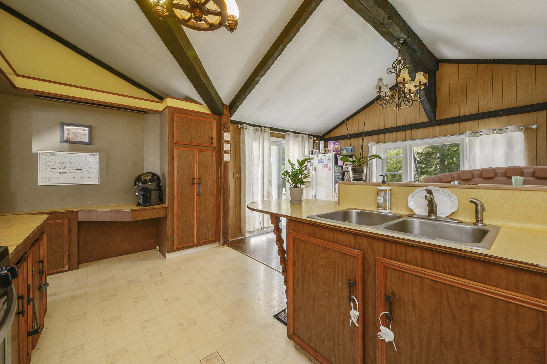 358 Strawberry Hill Road Centerville, MA 02632 - Photo 8 of 25 a kitchen with stainless steel appliances a sink stove and cabinets