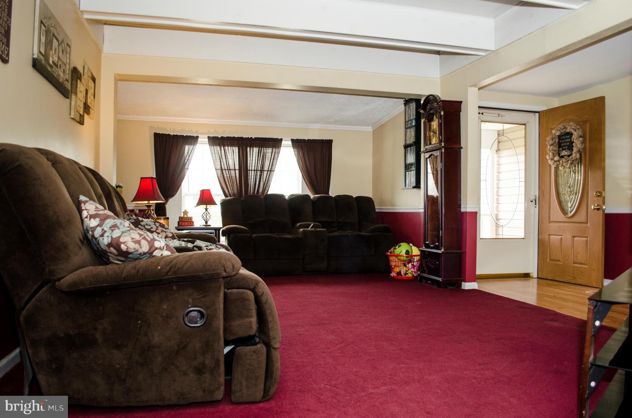 305 Algers Avenue Ranson, WV 25438 - Photo 11 of 30 a living room with furniture and a couch