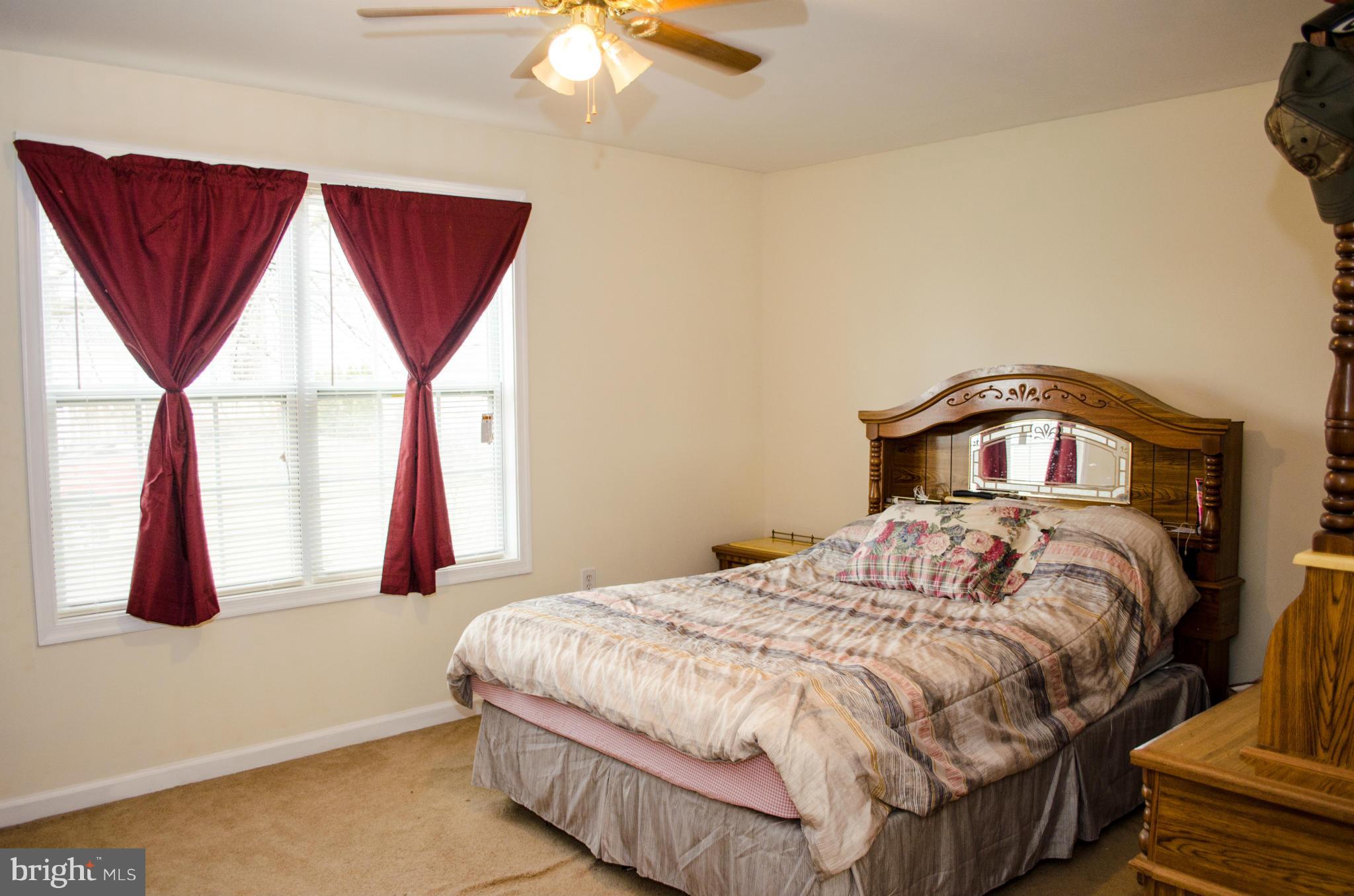 305 Algers Avenue Ranson, WV 25438 - Photo 15 of 30 a bedroom with a bed and window